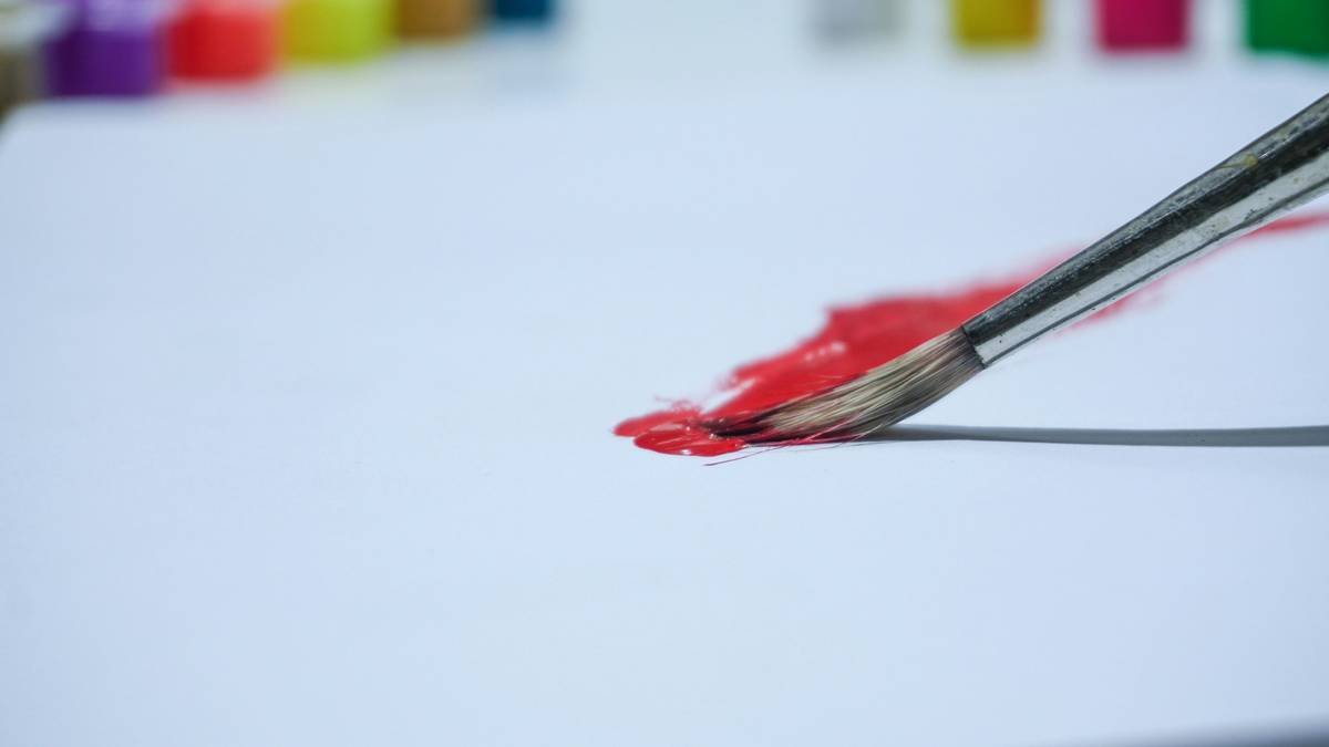 Side-by-side image showing unprimed nail with streaky polish vs. primed nail with smooth, even polish application