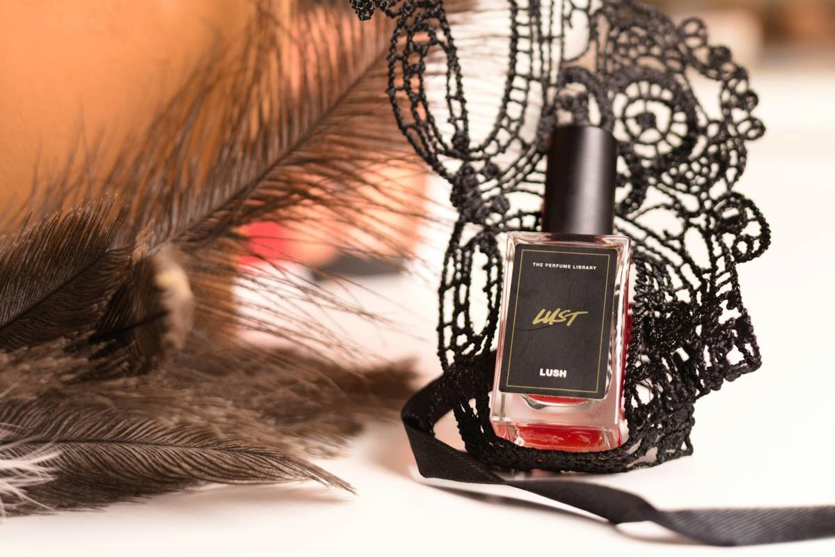 Applying color preserving primer evenly on clean natural nails